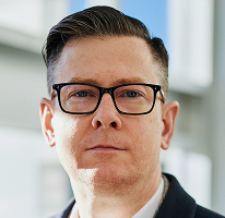 Executive portrait of Alexander Hughes, CEO of a crypto trading company